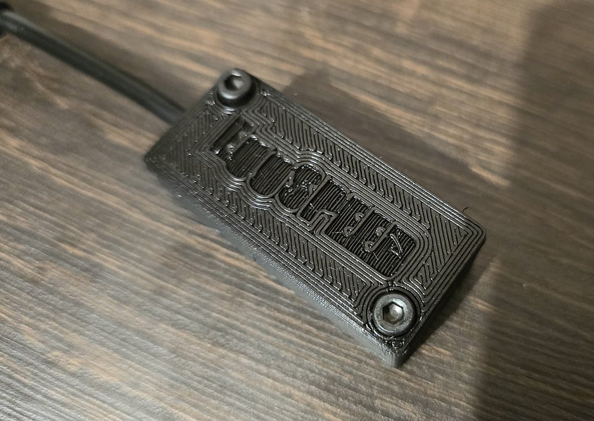 The converter in its 3D-printed enclosure